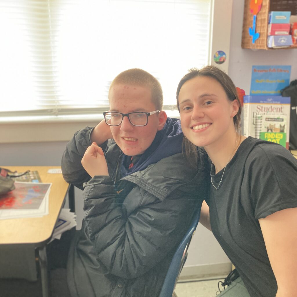 A student and teacher smiling in the Classroom