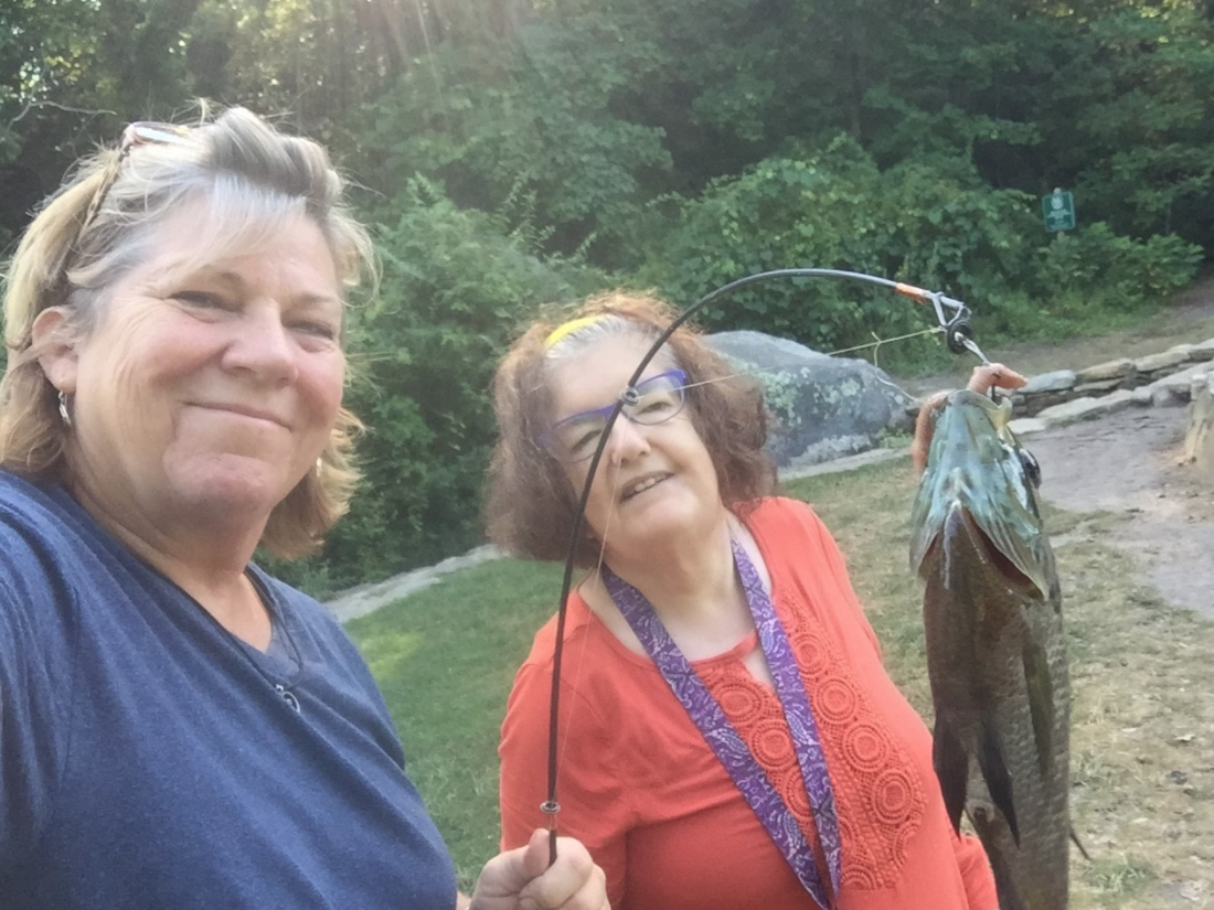 Adult resident and staff fishing