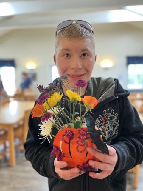 Student holding his horticulture project