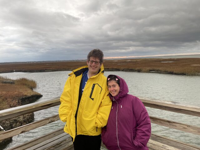 Two Students watch sunset during the Cape Cod Winter