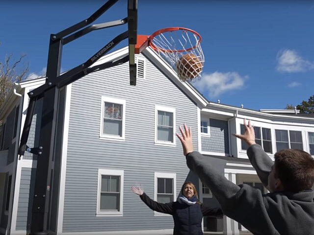 Latham Student and Staff play basketball.