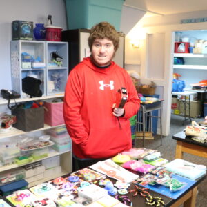 A student works in our vocational program as School Store Clerk