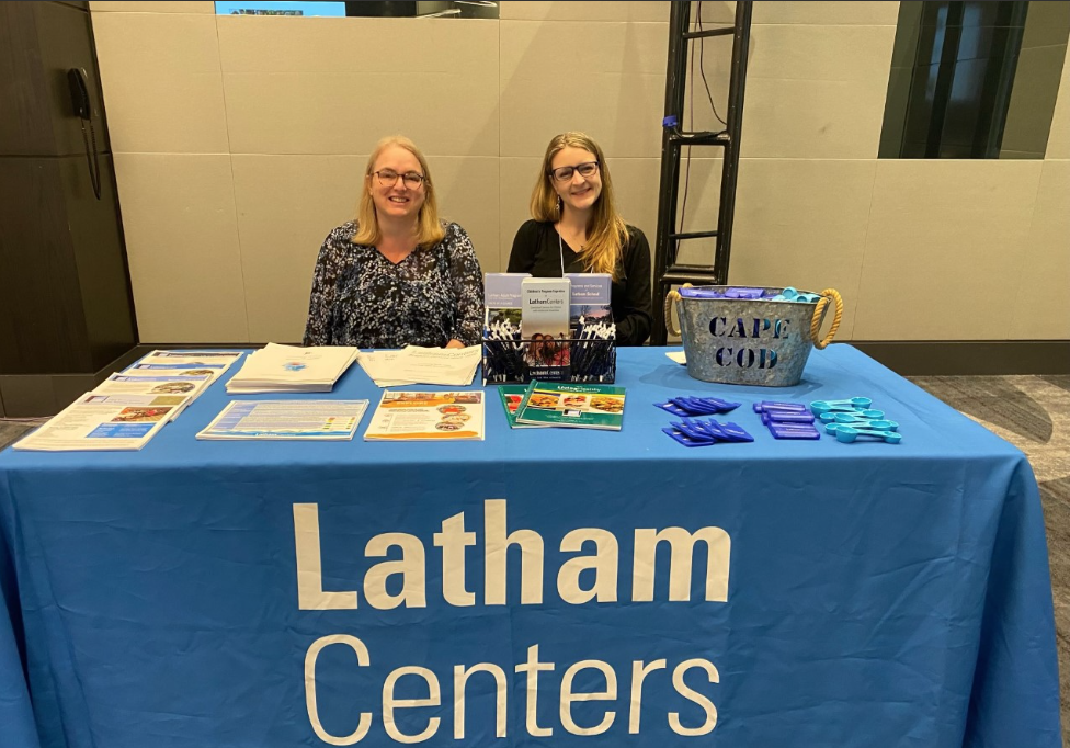 Two staff attend a job fair