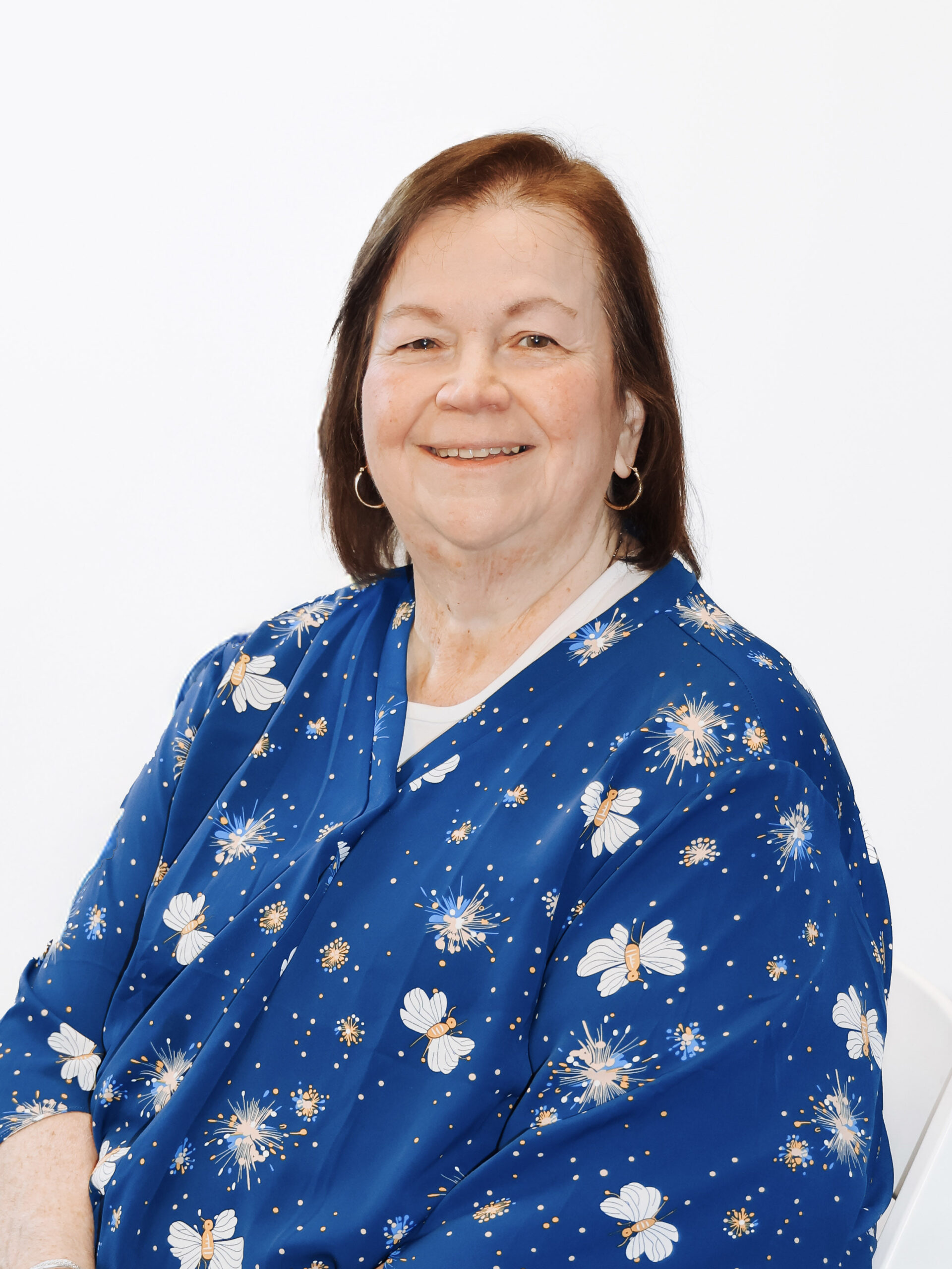 Woman wearing blue shirt with brown hair