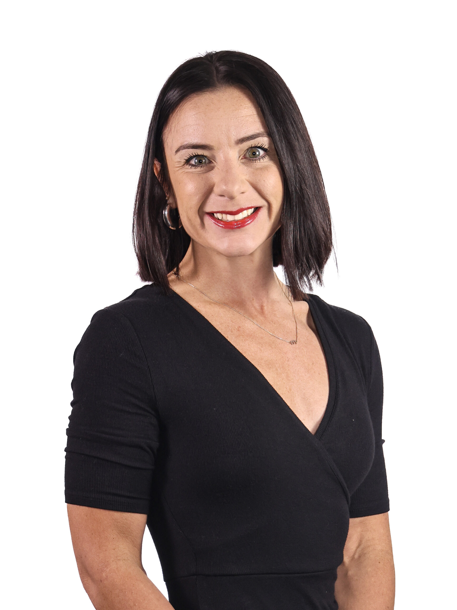 Woman with short dark hair wearing black shirt, formal