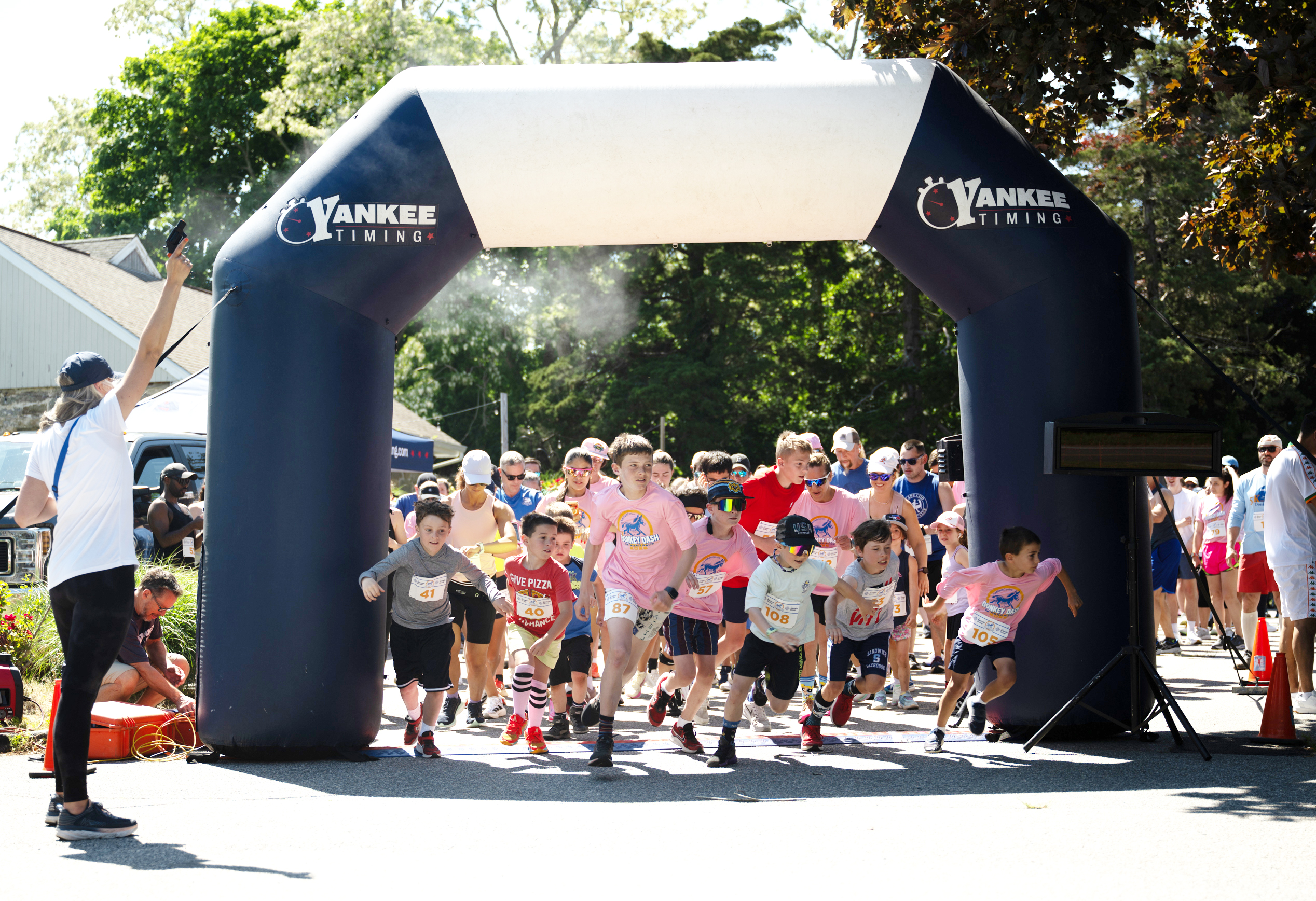 Group of people starting a road race.